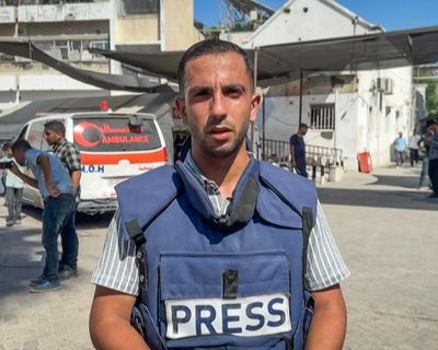 Mourners gather amid outrage over Israeli troops’ killing of journalists in Gaza – as it happened