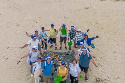 Lottery winners join beach clean-up to ‘give something back’