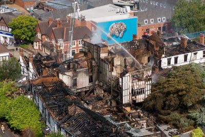 Two girls arrested after suspected arson attack destroys historic hotel