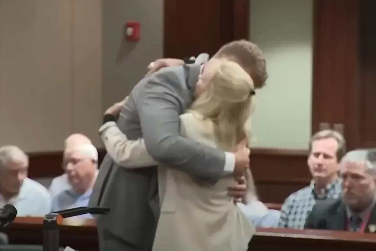 Moment woman hugs her husband’s killer in court after…