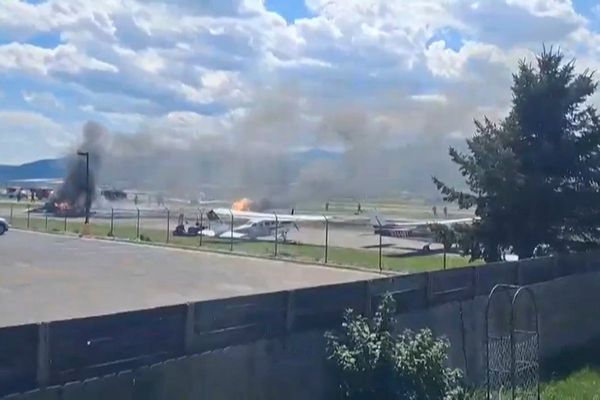 Plane crashes into parked aircraft while landing at Montana airport, sparking fire