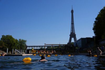 Tourists embrace new favourite pastime as heatwave scorches Paris