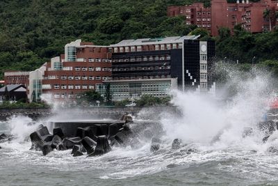 Flight cancellations and evacuations ordered as Typhoon Podul makes landfall in Taiwan