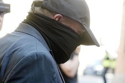 Funeral director appears in court charged over human remains found at premises