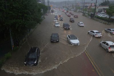 Heavy rain pounds South Korea's capital region, leaving 1 person missing