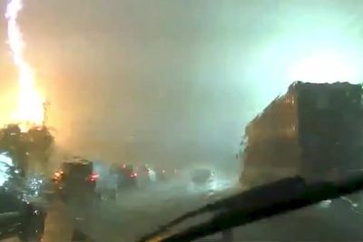 Dash cam footage captures pillar of fire sparked by dramatic lightning strike
