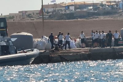 A boat carrying migrants capsizes off Italy, killing at least 26