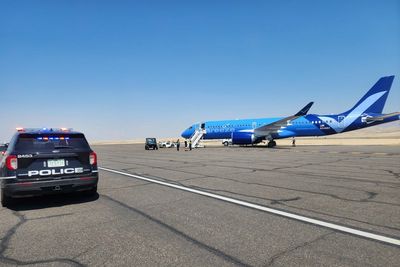 Flight diverted after skateboard-waving drunk passenger yelled racial slurs, police say