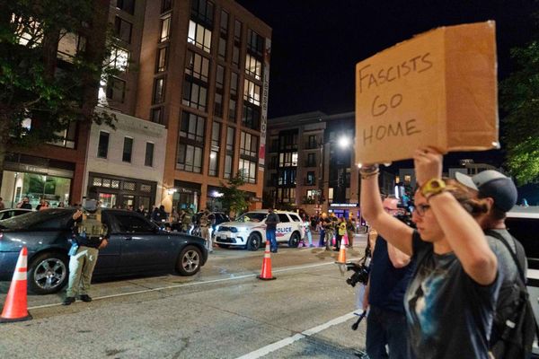 Protesters confront federal officers as Trump tightens grip on DC policing