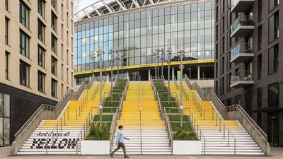“The installation mirrors the song’s structure, step by step, turning lyrics and melody into a visual path”: Wembley Stadium unveils an all yellow Coldplay-related artwork to mark the band’s residency