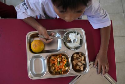 Hundreds hit by food poisoning after eating free school meals in Indonesia