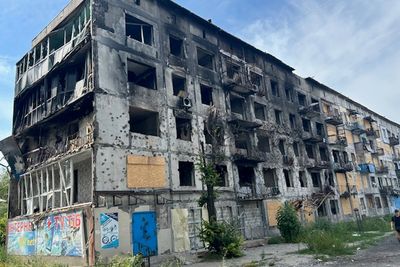 ‘Three weeks ago, this town was thriving’: Ukrainians flee the front line in Putin’s frantic land grab