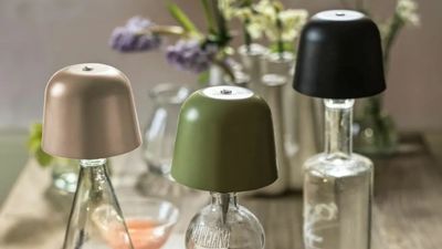 These Light-Up Bottle Stoppers Make Your Old Wine Bottles Look Like Mid-Century Designer Lamps
