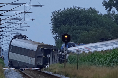 Woman dead and dozens injured after train carrying 100 passengers collides with slurry tanker in Denmark