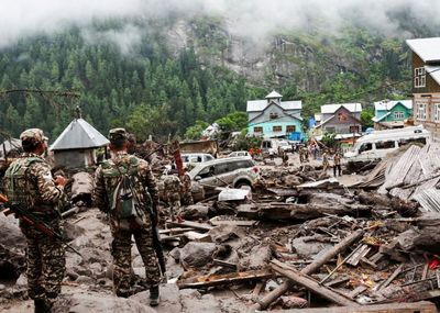 'Doomsday' floods and landslides kill more than 300 in Pakistan and Indian Kashmir with mass funerals held