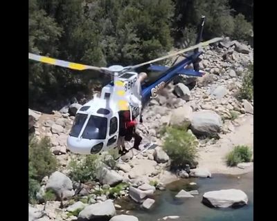 ‘Stunning survival story’: police rescue California man trapped behind waterfall for two days