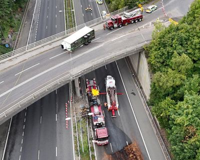 Tractor falls from bridge on to M20 leaving driver critically injured