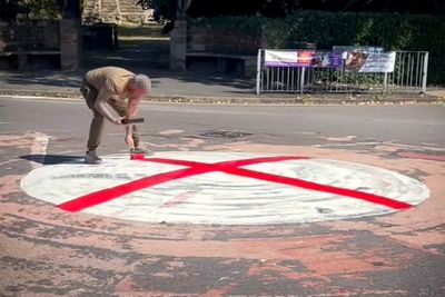 Why are St George’s flags being put up and roundabouts painted and why is it controversial?