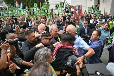 Hundreds of Kneecap supporters greet rapper Mo Chara as he appears at court on terror charge