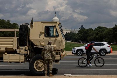 Military vehicle crashes into car in DC as states send more national guard troops