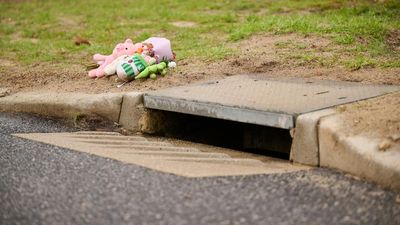 Woman assisting police after baby found in storm drain