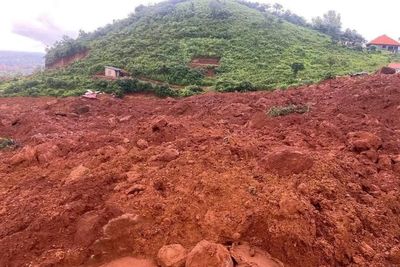 A landslide buries homes outside Guinea's capital, killing 11 and injuring 10