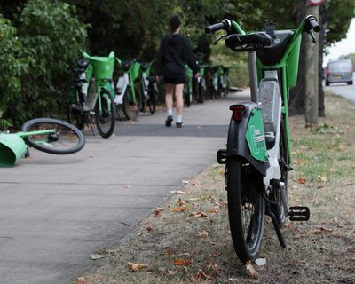 ‘A nuisance and an eyesore’: hire ebikes accumulate at London border between rival firms