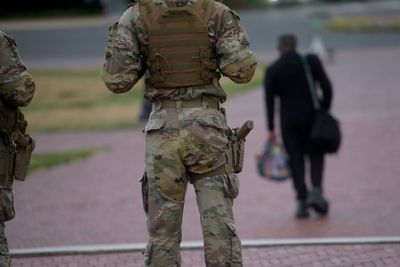 National Guard now carrying pistols in Washington as troops enter third week deployed to capital