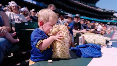 No One Had a Better Day Than This Kid Eating His Bodyweight in Popcorn at Ballpark