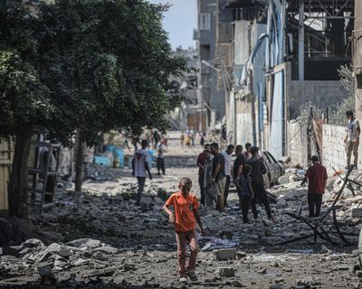 ‘No place is safe’: families flee Gaza City as Israel vows to press on with offensive