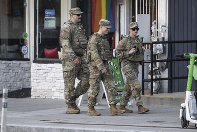 US National Guard troops begin carrying weapons in Washington, DC