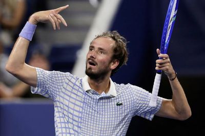 Daniil Medvedev has meltdown after photographer walks on court at US Open match point - before angrily smashing racket on ground