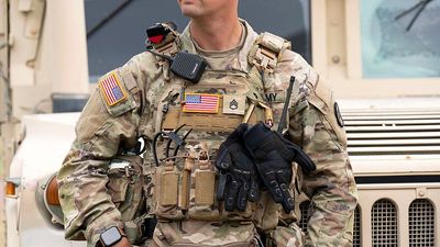 US National Guard units begin carrying weapons in Washington