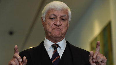 Feast Your Eyes On This Very Real Image Of Bob Katter Reading His Own Book At An Airport