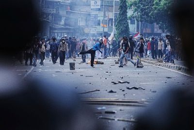 Riot police clash with students protesting lawmakers' allowances in Indonesia