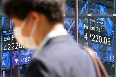 Asian shares decline following Wall Street's dip