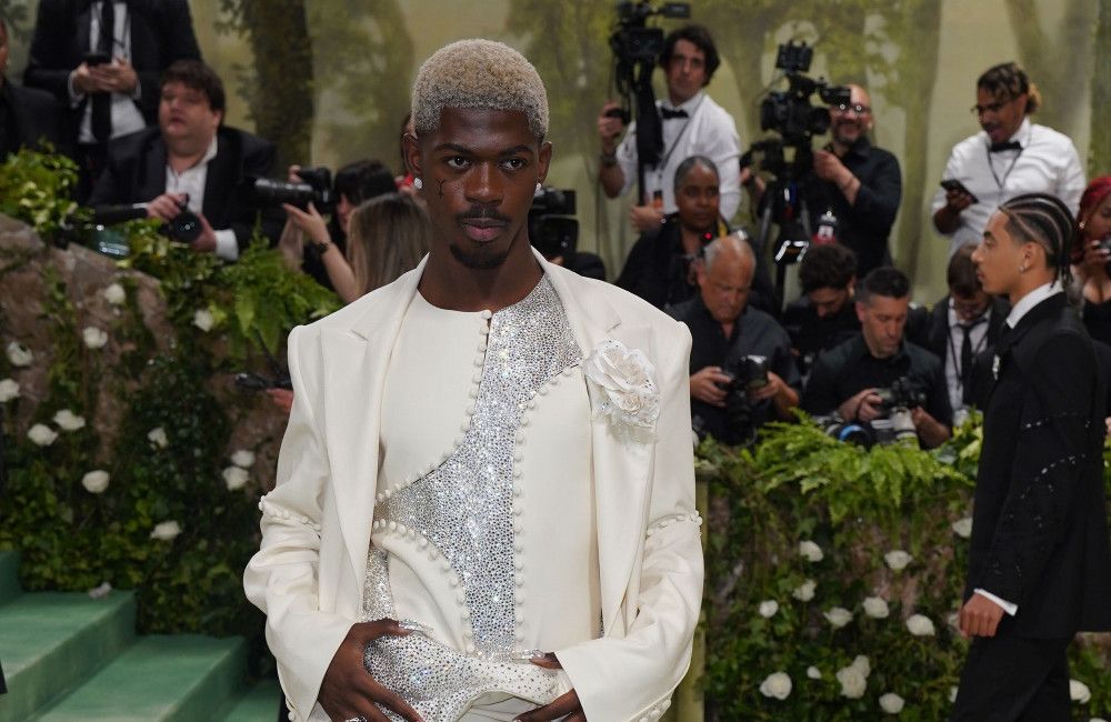 Lil Nas X charged with four felonies including three…
