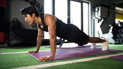 A top strength coach shares a five-move weight-free workout to build a bigger chest