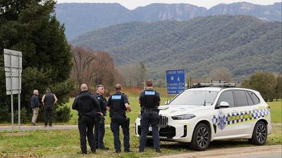 Manhunt for gunman in fatal shooting of two Australian police officers continues