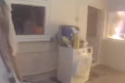 Watch moment sleeping woman rescued from burning house by heroic police officers