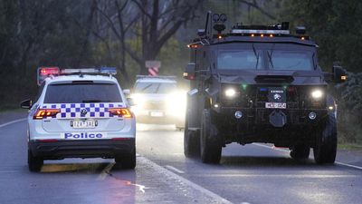 Dangerous terrain hampers search for accused cop killer
