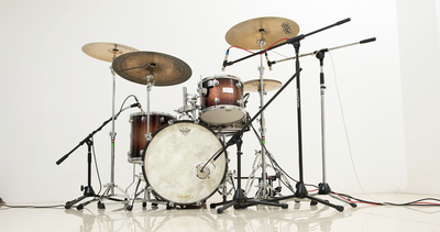 “The minute you put a microphone right up against the skin of a drum you've got a problem because it doesn't sound like it's supposed to”: How the rules of drum recording were shaped over decades of trial and error