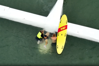 Pilot pulled from plane wreckage underwater in dramatic rescue