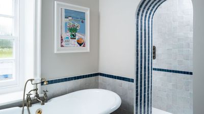 This slim and stylish $26 shelving unit is 'perfect' for tidying up messy bathrooms without damaging walls