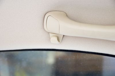 The Real Reason Your Car Has Handles Above the Doors