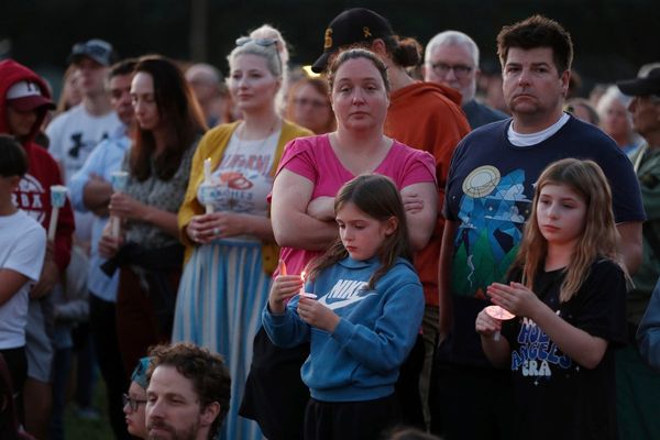 Hundreds honor 2 children killed and 17 people wounded in shooting at a Minneapolis Catholic school
