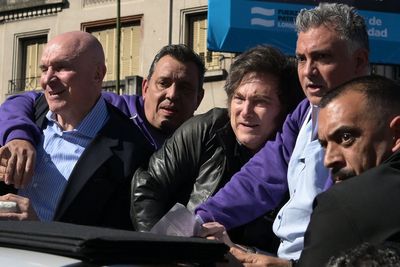 Protesters hurl rocks at Argentinian president Javier Milei during campaign rally amid corruption allegations