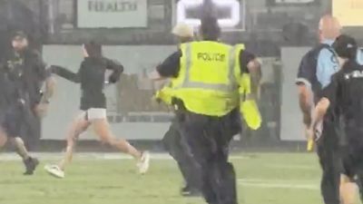 UCF Fan on Field Gets Lit Up By Security During Lightning Delay