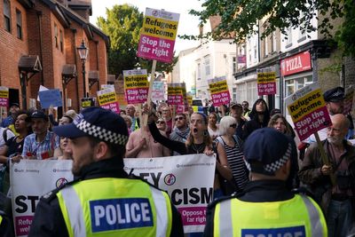 UK government wins appeal over ruling that would have blocked asylum-seekers staying in hotel