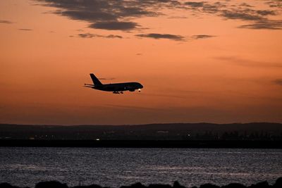 Overseas holidays and pints at the pub: five things Australians are splurging on as household budgets bounce back